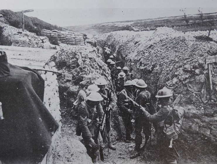 Soldiers crowded in a trench