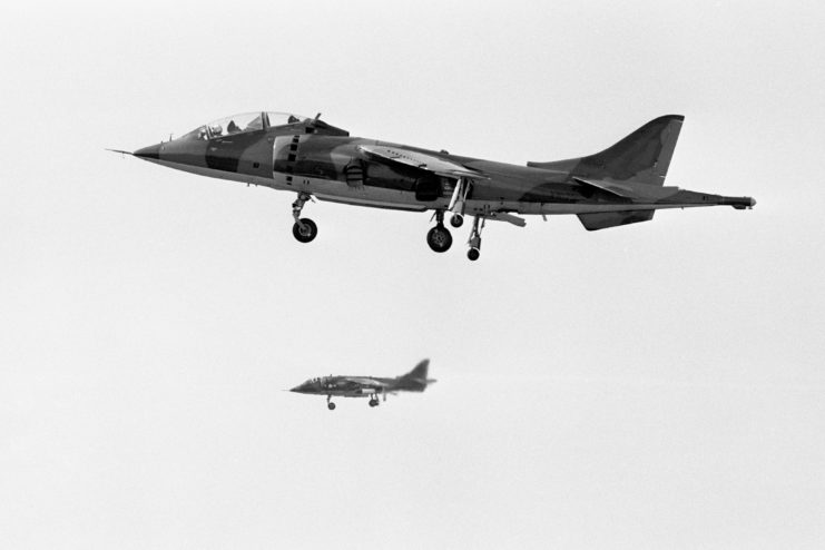 Two Harrier jets in flight