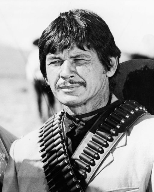 Charles Bronson with ammo slung over his shoulders