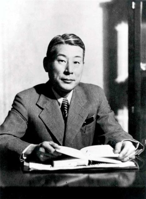 Chiune Sugihara sitting at a desk