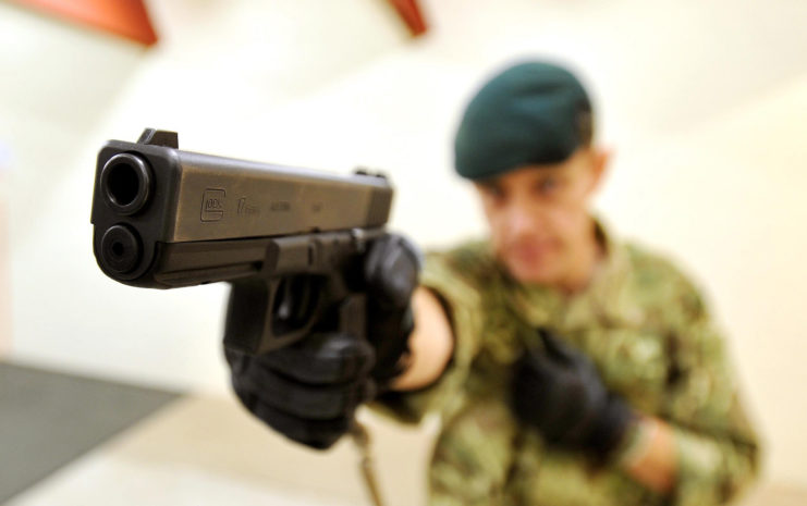 A Royal Marine tests a Glock 17 Pistol