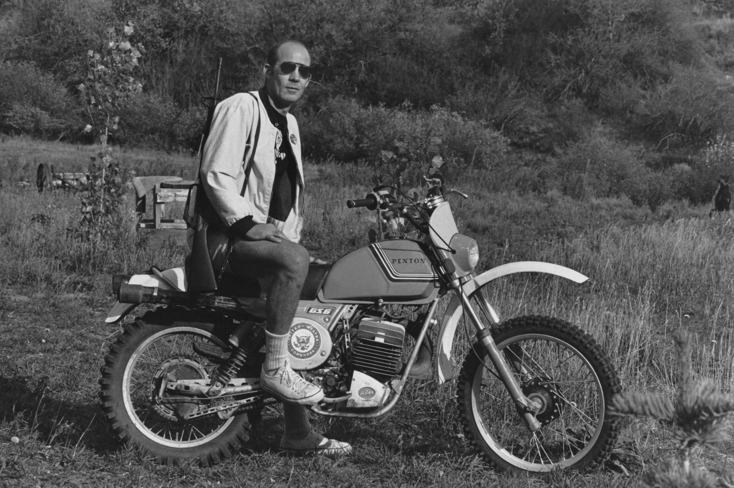 Gonzo journalist Hunter S. Thompson sits on a Penton Motorcycle