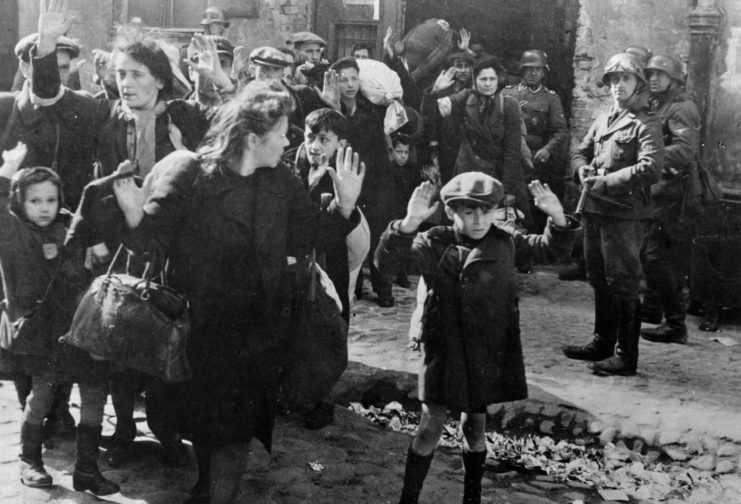 German troops forcing Jewish civilians out of the Warsaw Ghetto