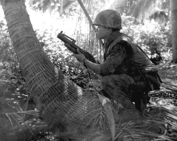 Thai soldier crouching while holding an M79 grenade launcher