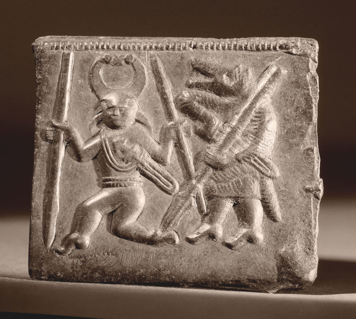 A Viking Helmet Plaque Matrix featuring Berserkers