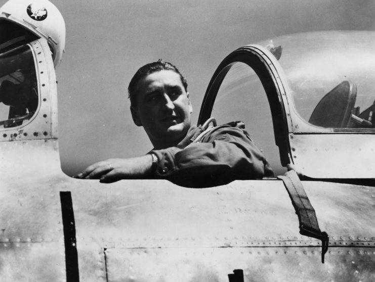 Gabby Gabreski sitting in the cockpit of an airplane