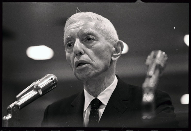 Rear Admiral Hyman Rickover speaking at a microphone