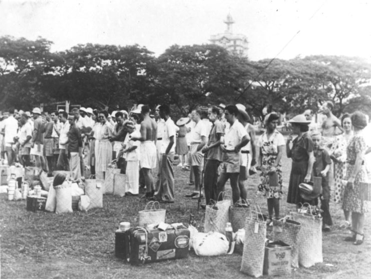 Caucasian internees arrive at the Santo Tomas Camp during World War 2