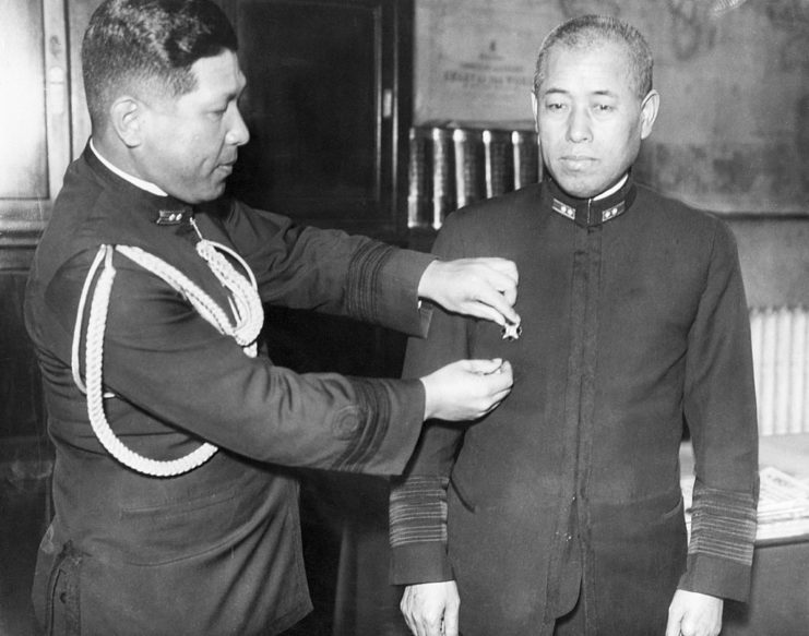 Isoroku Yamamoto receiving a medal from a superior