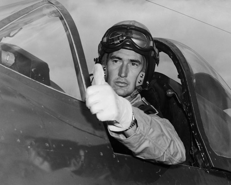 Ted Williams giving a thumbs up from the cockpit of a jet