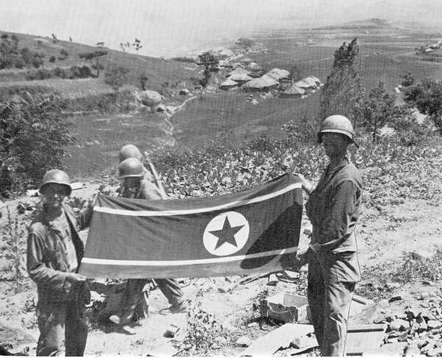US infantrymen holding the North Korean flag
