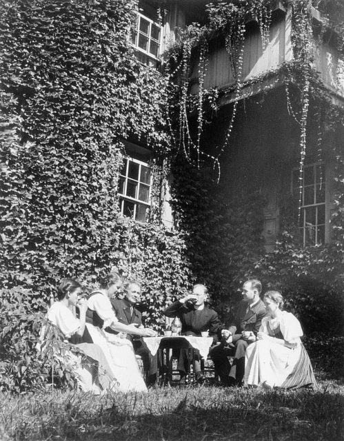 Members of the von Trapp family sit around a table outside their Vermont home.