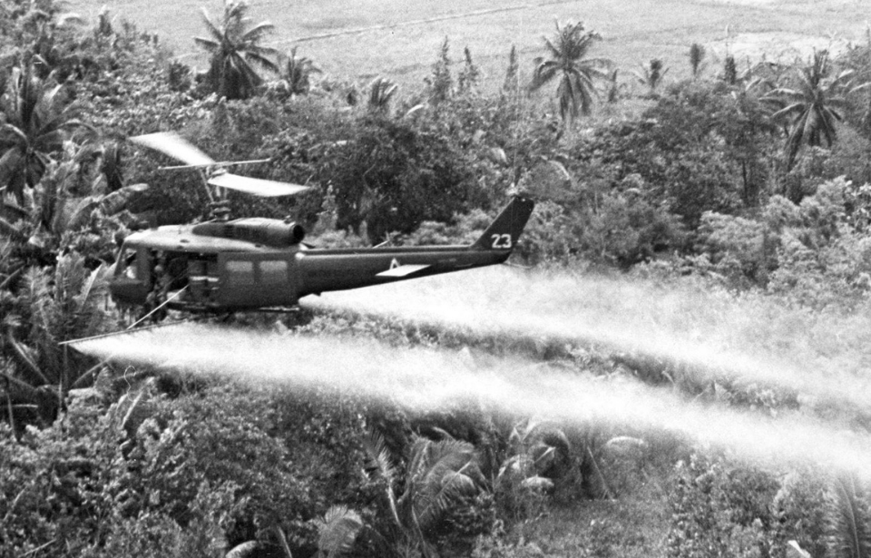 US Air Force helicopter spraying Agent Orange over the jungle