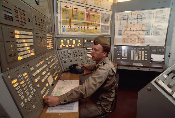 Soviet soldier sitting in a control room