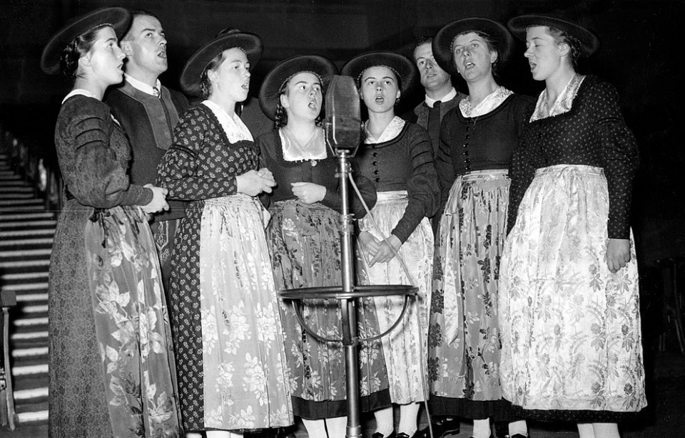 von Trapp family singing into a microphone