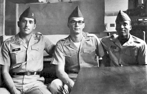 Private First Class James Johnson Jr., Private Dennis Mora and Private David A. Samas sitting together