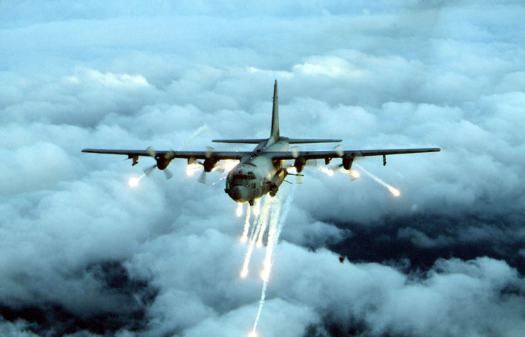 Lockheed AC-130 dropping flares mid-flight