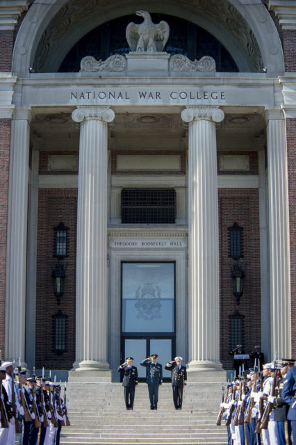 Soldiers at attention outside the doors of Roosevelt Hall at the National War College