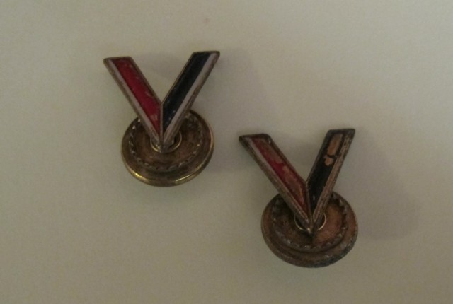 Original 'Double V' pins from the 'Double VV' Campaign in WWII displayed at the Kansas African-American Museum. (Photo Credit: Carla Eckels/KMUW)