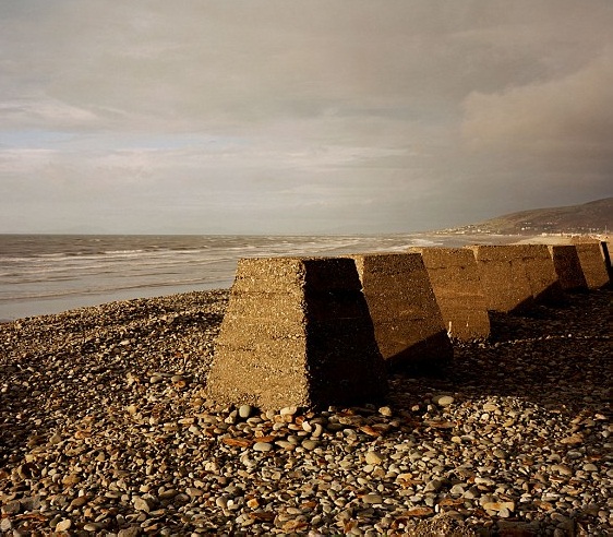 The series of coastline defenses set out during that time where the tank traps were part of extended up to the Welsh coast.