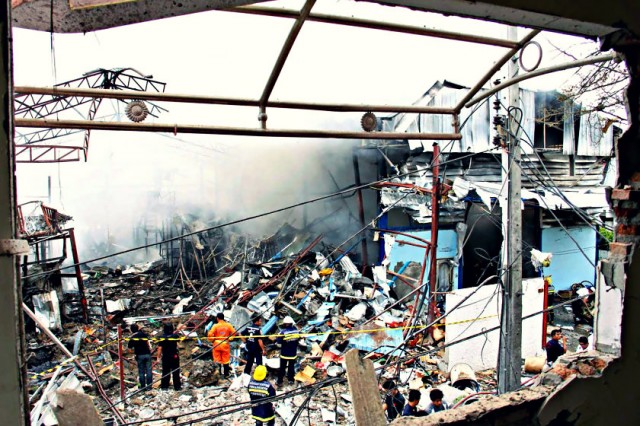 The Bangkok scrap shop blown up after the unclassified WWII vintage bomb exploded.