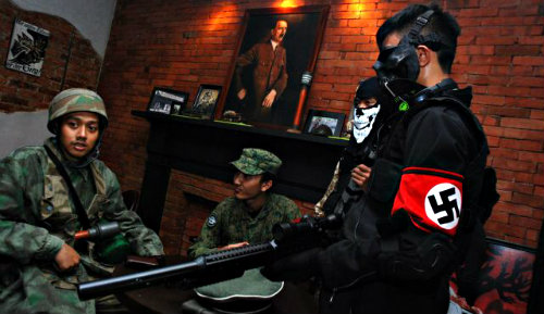 Customers at SoldatenKaffe wearing various kinds of WWII uniforms during its reopening.