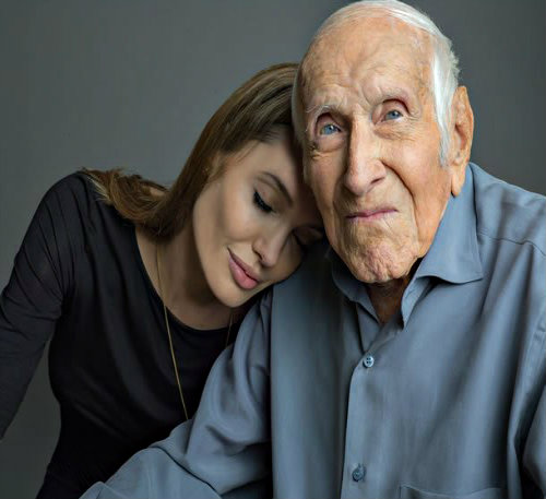 Angelina Jolie with WWII hero Louis Zamperini who  also was her neighbor and friend in LA prior to directing the movie about his life.