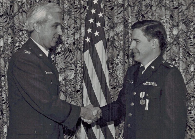 Captain Bill Stine, right, receives an Air Force Commendation Medal in 1982 in recognition of his work while stationed at Hanscom Air Force Base in Massachusetts. Courtesy of Bill Stine. 