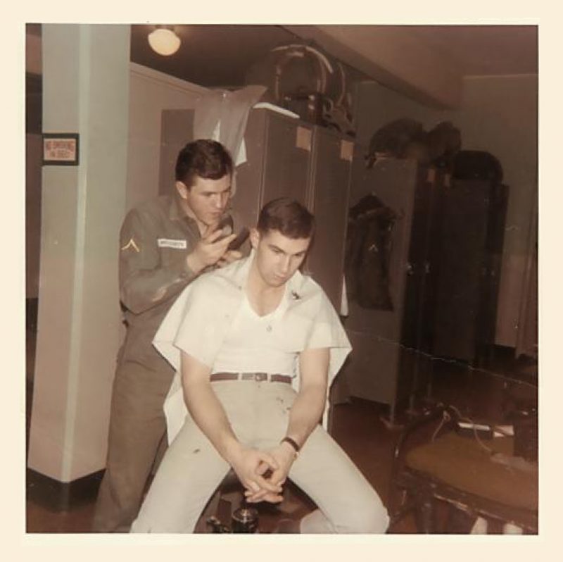 Trained as a barber prior to his enlistment, Rich McCarty, pictured above holding clippers, continued to cut hair while serving with the Army in Alaska. Courtesy of Rich McCarty