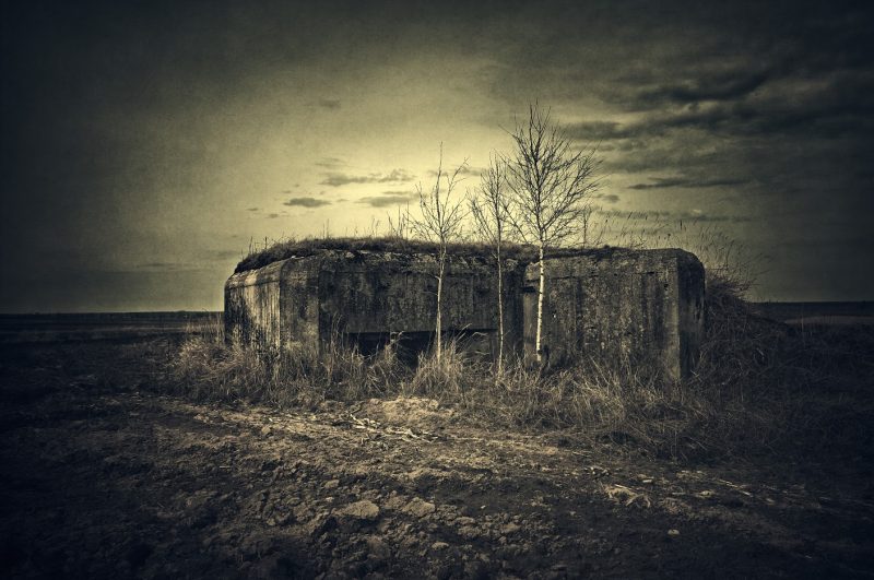 A simplified version of an antitank pillbox. No hydraulics, no armor housings, just a concrete slab designed to protect a 45 mm antitank field piece which was simply rolled inside.These kind of bunkers were usually pushed to the foreground, usually several kilometers ahead of the main defense line.In this particular area Soviet border in 1941 formed a sharp bulge dangerously protruding into German territory, just begging to be cut off. Main strongpoints were therefore built farther to the rear and the borderline was screened with a number of simplified constructions.Still, they were unmanned and were generally left undefended and therefore were quickly bypassed by the advancing Germans.