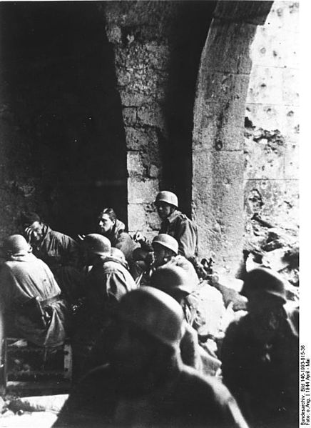 German Paratroopers take cover in a building during the fighting.