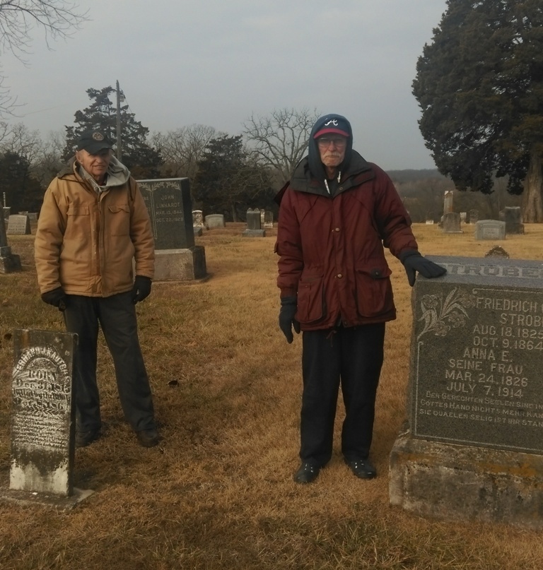 Don Buchta, left, and Roger Buchta stand next to the graves of Ehrhardt Kautsch and Friedrich Strobel in the cemetery at St. Paul’s Lutheran Church in Lohman, Mo. Courtesy Jeremy P. Ämick 