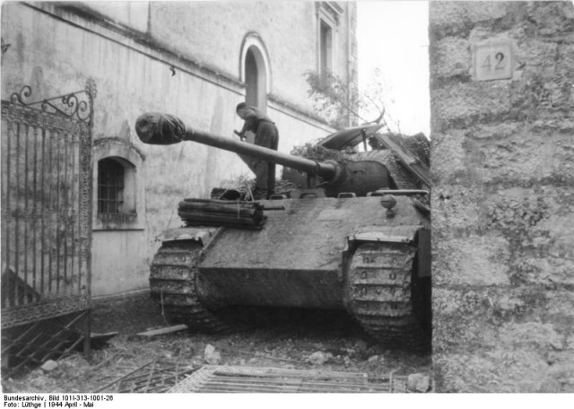 The crew of a Mark V "Panther" tank, presumed in the town of Cassino.