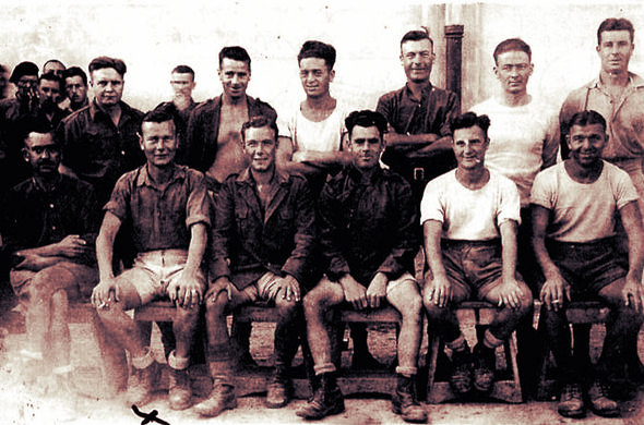 Robbie Clark as a POW in Italy [second from left on the front row].