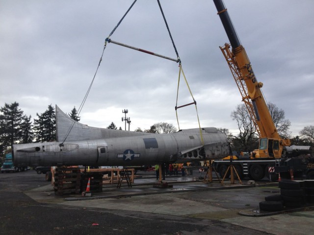 Lacy Lady being towed down after 60 years of service as a gas station roof. - Facebook