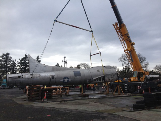 Lacy Lady being towed down after 60 years of service as a gas station roof. - Facebook 