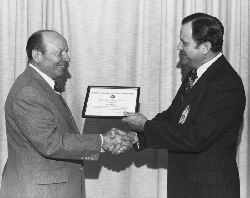 James W. Bass, left, receives a 30-year service award on March 2, 1979 from fellow NASA employee Dr. William R. Lucas, director of the Marshall Space Flight Center from 1974 to 1986. Courtesy of Jeremy P. Ämick 