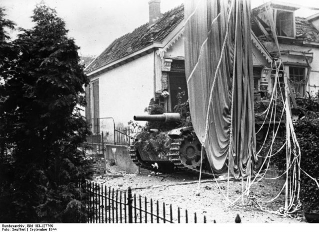 A German Self Propelled gun, Stug III in Oosterbeek close to the positions of the 2nd South Staffords. Note the supply Parachute.