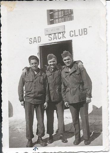 Thomas M. McGraw is the center, flanked by two of his mates.