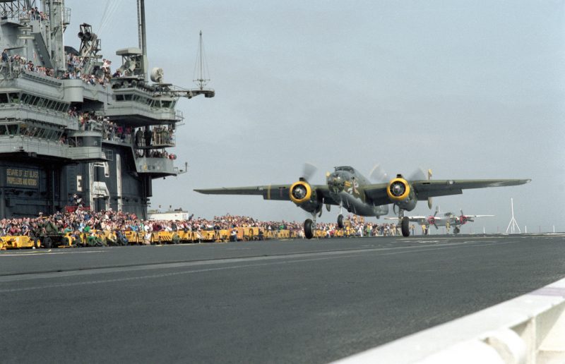 The restored World War II B-25 Mitchell bomber aircraft "Heavenly Body" takes off from the deck of the aircraft carrier USS RANGER (CV-61) 