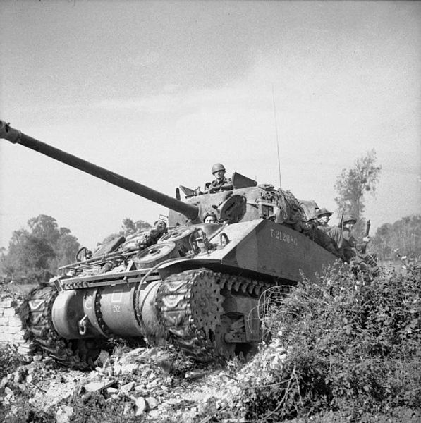 Sherman Firefly carrying infantry during Operation 'Goodwood', 18 July 1944.