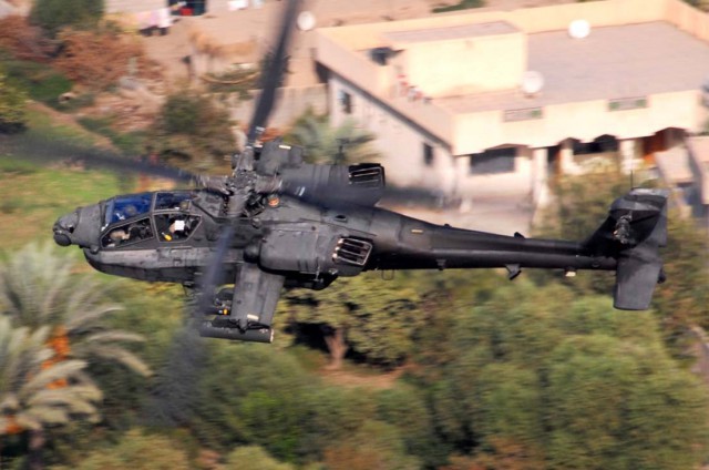 Photo by Chief Warrant Officer 4 Daniel McClinton, 1st ACB October 15, 2007 An AH-64D Apache from Company B, 1st "Attack" Battalion, 227th Aviation Regiment, 1st Air Cavalry Brigade, 1st Cavalry Division, flies over a residential area in the Multi-National Division-Baghdad area Oct. 12. The Apache crew was conducting a reconnaissance mission to keep an eye out for enemy mortar and anti-aircraft systems.