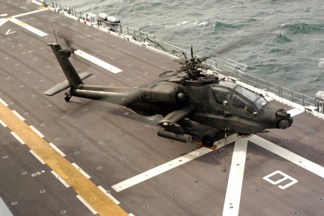 050201-N-6019M-001 Atlantic Ocean (Feb. 1, 2005) - A U.S. Army AH-61 Apache helicopter prepares to launch from the flight deck aboard the amphibious assault ship USS Nassau (LHA 4) during Joint Shipboard Weapon Ordnance (JSWORD) training. The JSWORD exercise provided an excellent opportunity for Navy and Army ordnance personnel to work together in a joint training environment. The AH-64 Apache is a twin-engine, four bladed, multi-mission attack helicopter designed as a highly stable aerial weapons-delivery platform. U.S. Navy photo by Photographer's Mate 1st Class Brian McFadden (RELEASED)