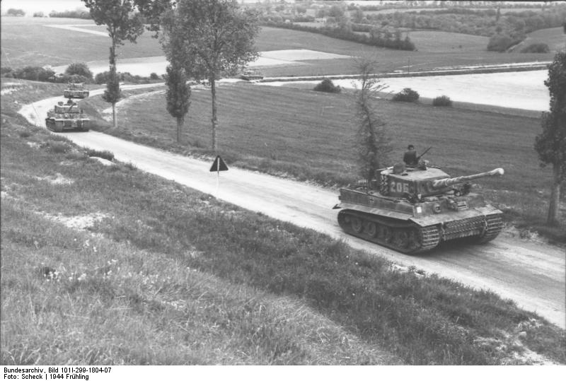 Tiger I heavy tanks of the German 1st SS Division Leibstandarte SS Adolf Hitler on a country road in Northern France, spring 1944 via Bundesarchiv
