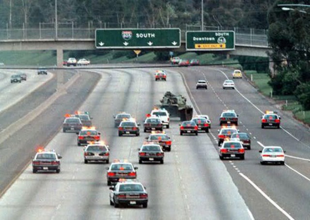 TANK CHASE:  5/15/1995.  San Diego Police and the California Highway Patrol chase a stolen military tank down Interstate 805.   The tank was stolen from the National Guard Armory by Shawn T. Nelson, who led police through the streets of Linda Vista before entering the freeway.  Nelson finally crashed the tank into the center divider of Southbound Highway 163 and was shot dead by San Diego Police.                   Photo @ 1995 Tom Keck
