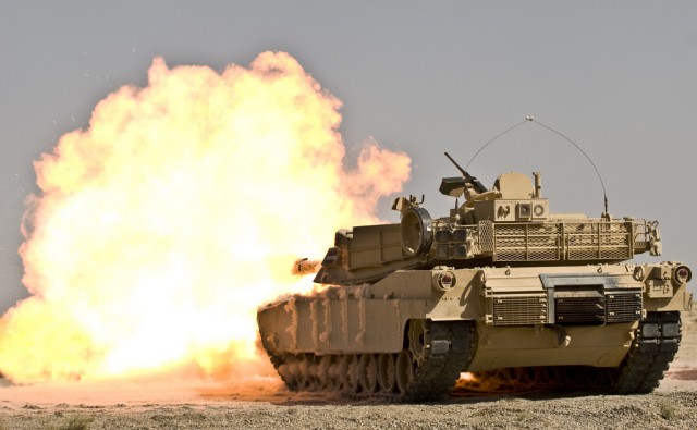 An Iraqi M1A1 Abrams tank belonging to 1st Company, 2nd Regiment, 34th Brigade, 9th Iraqi Army fires a shot downrange at the Besmaya Combat Training Center, Sept. 27 as part of the M1A1 Maneuver Collective Training Course. This armor company  is the first  to complete this training which focuses on movement techniques at the platoon level to increase crew competency. This company of tankers is the first company to participate in this specific course which focuses on movement techniques at the platoon level to increase crew competency.