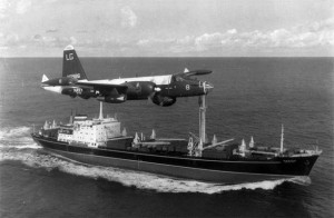 A US Navy Lockheed SP-2H Neptune flying over a Okhotsk Soviet cargo ship carrying twelve II-28s airplanes