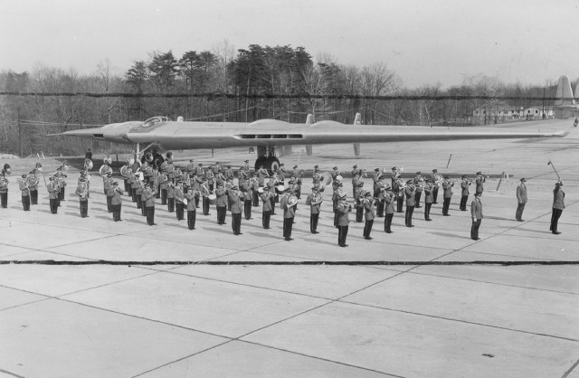 JUN 5 1949 With a giant B-49 flying wing in the background, the noted air force band prepares for its Colorado concerts. The band will play for the governors' convention in Colorado Springs June 19 and 20, then will come to Denver for a free concert in Red Rocks park June 21. Arrangements for the concert her made by The Denver Post and Air Secretary W. Stuart Symington. being made to admit 10,000 persons to the concert in Red Rocks. Credit: Air Force Photo