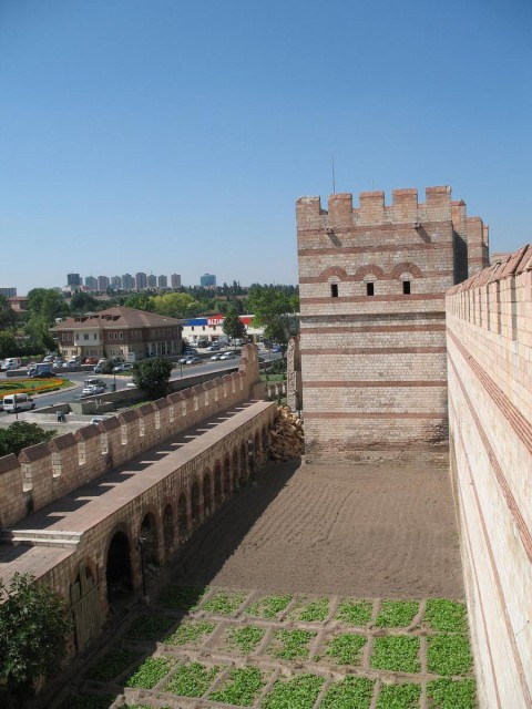 view of the space between the walls. attackers would have a very difficult time regrouping and attacking the larger wall after struggling to get over the first one