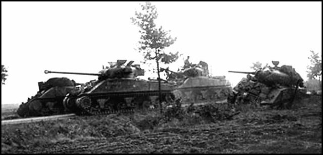 XXXCorps tanks pass destroyed tanks